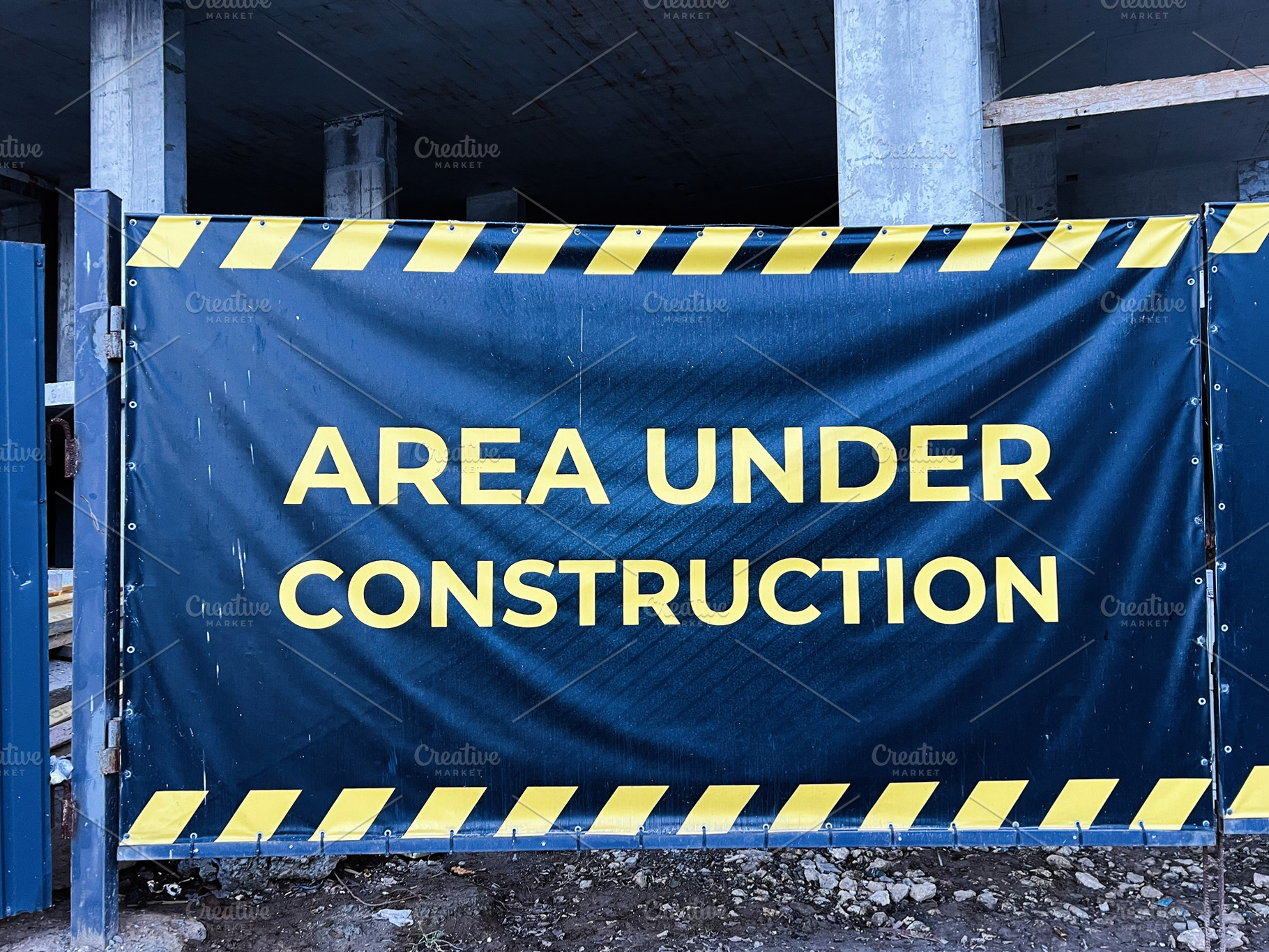Construction site banner warning area under progress with striped border design, a Photo by AS photostudio