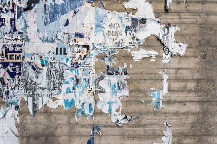 Wall with ripped posters, a Wallpaper Photo by KYNA STUDIO