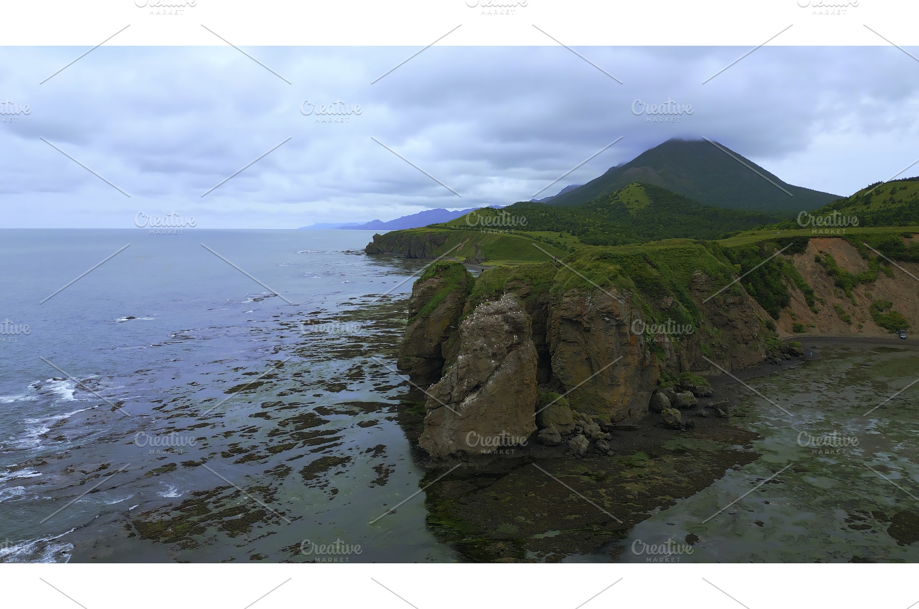 Rocky coast with algae after storm, a Nature Photo by Media Whale Stock