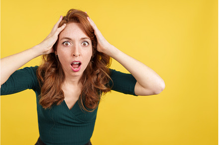 Surprised redheaded woman gesturing, a Person Photo by Iván Moreno STOCK PHOTO