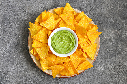 Corn tortilla chips in big plate., a Background Photo by Galiyah Assan