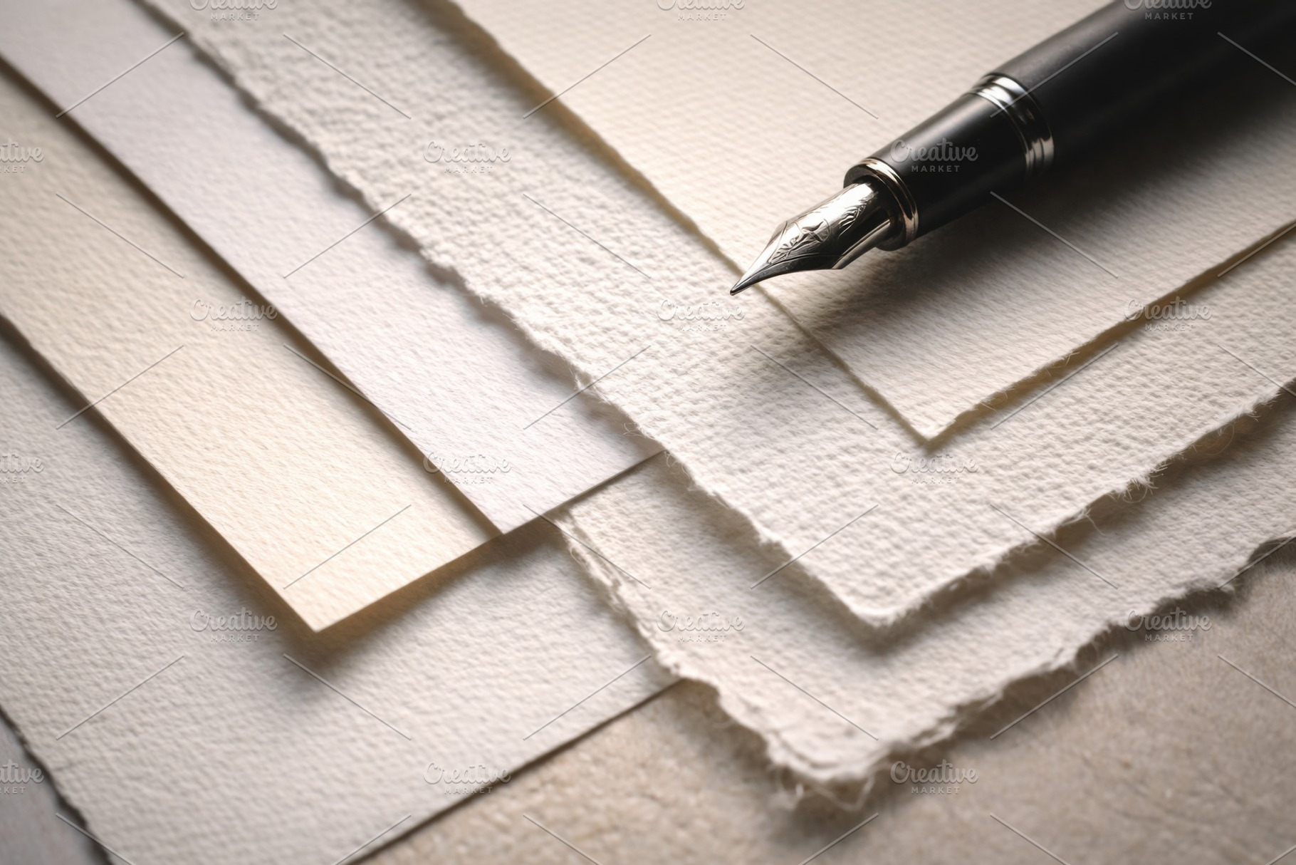 Fountain pen resting on textured pap, a Photo by Dvoevnore photos