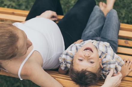 Happy little boy hugging mother featuring outdoor, travel, and child