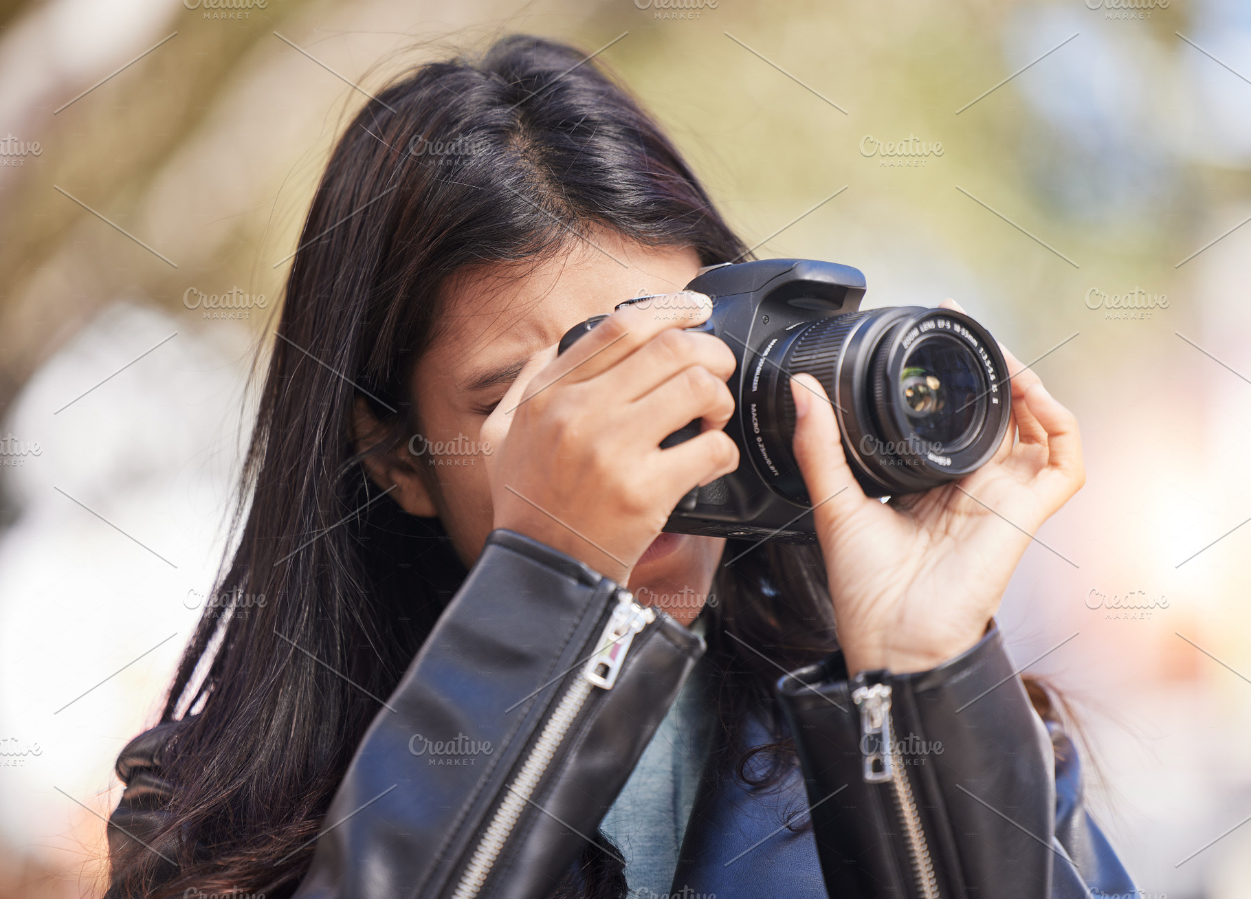 Nature, photography and woman in park with camera, trees, art and creative influencer with inspiration focus in media. Girl, photographer or content creator in garden taking picture for social media., a Photo by Peopleimages.com