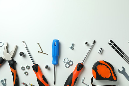 Work tools on white background, top view, an Industrial Photo by AtlasStudio PRO