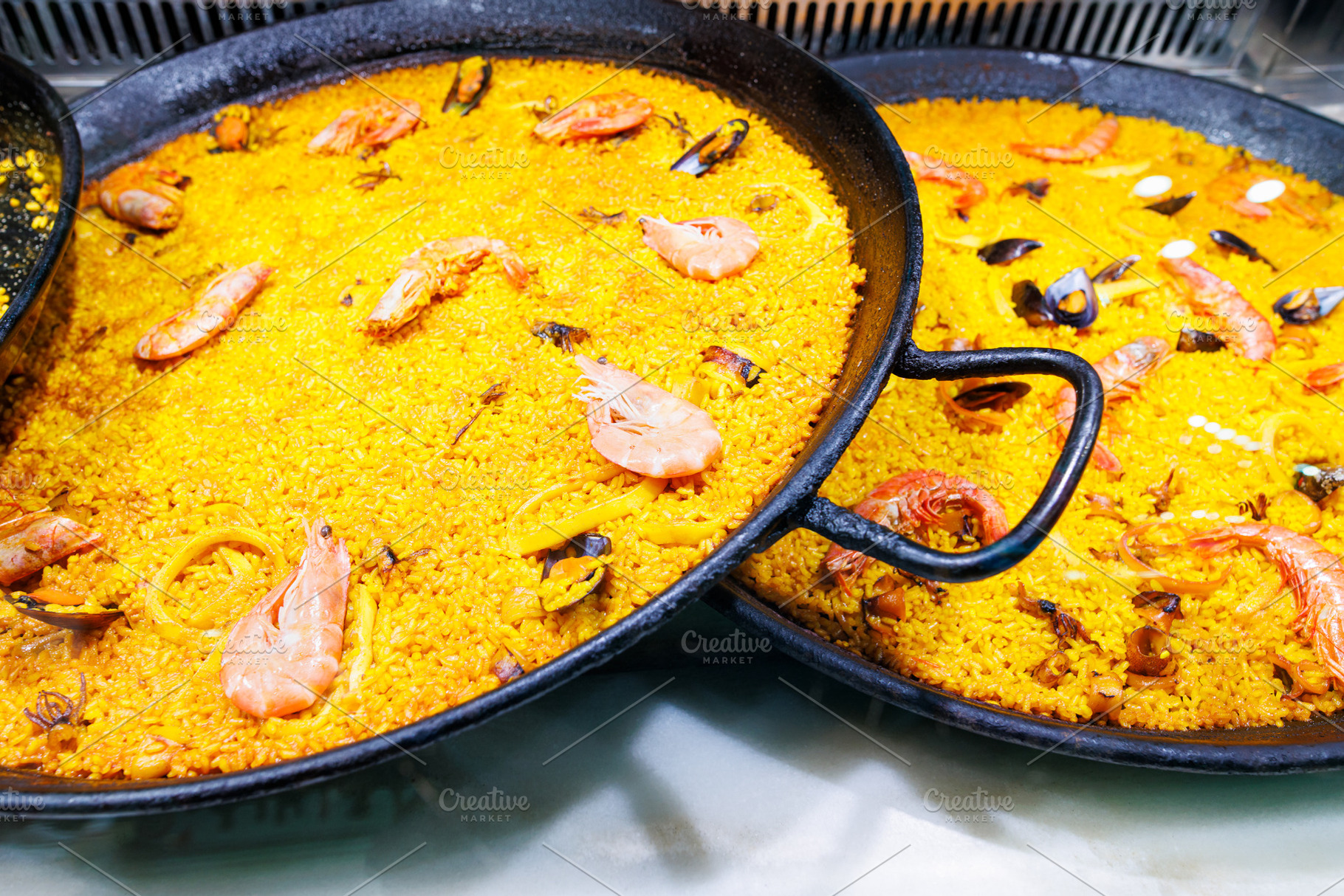 Delicious traditional Valencian seafood paella, a Food & Drink Photo by Bepslabor