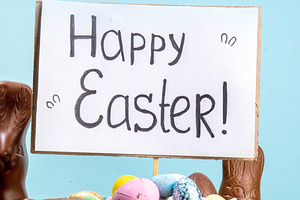Easter egg hunting background with chocolate eggs, Easter basket, a Holiday Photo by Rimma