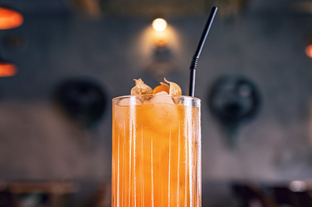 Cold and refreshing orange and lemon cocktail, a Photo by Grafvision photography