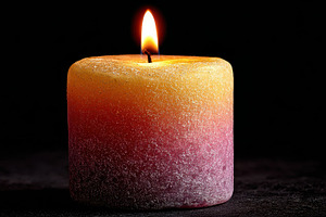 Burning ombre candle in dark backgro, a Photo by Pixeness Studio