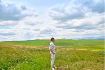 A man in light-colored clothes, a Person Photo by PhotoXab