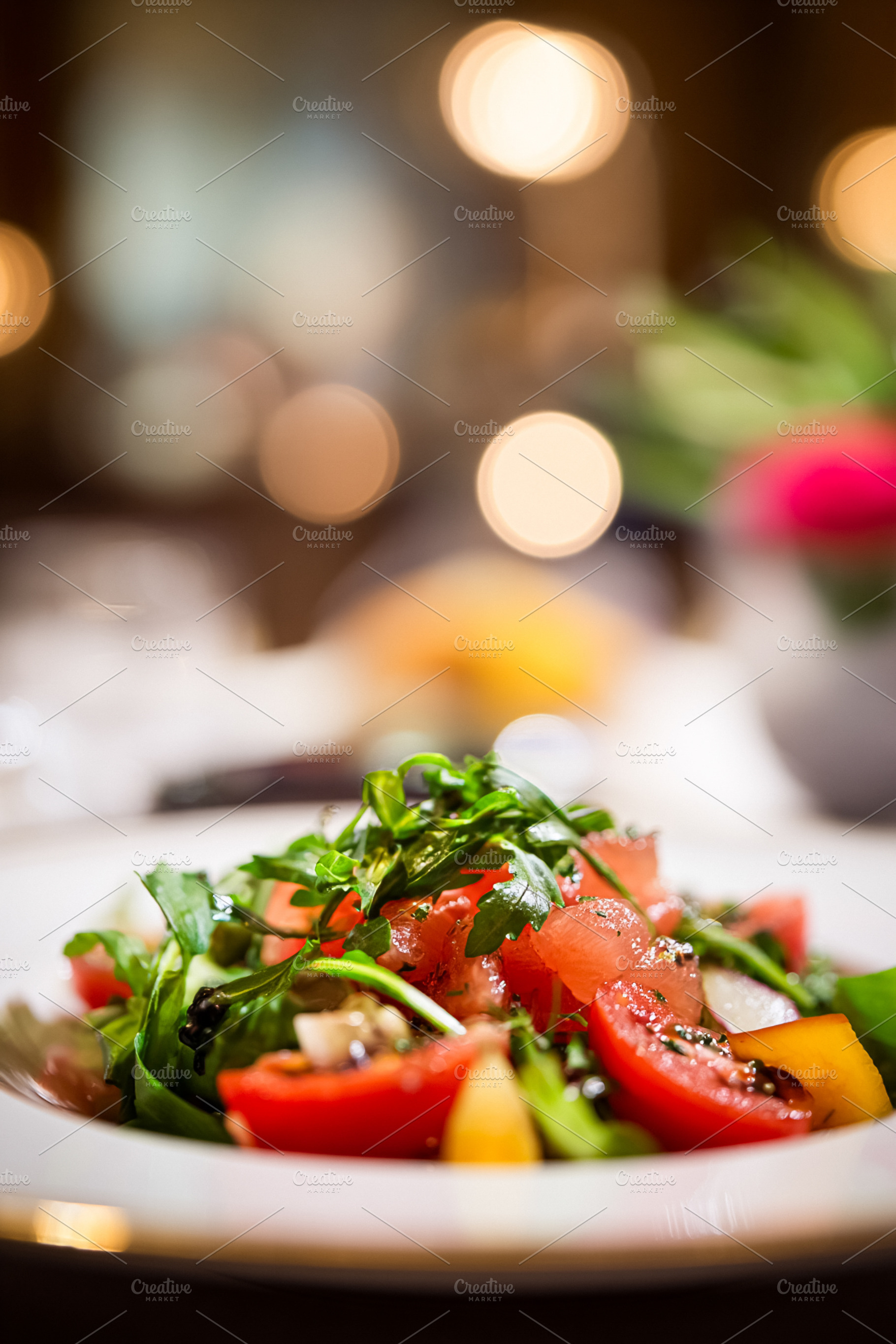 Fresh tomato and arugula salad served in a luxury hotel restaura, a Food & Drink Photo by Studio ANNA