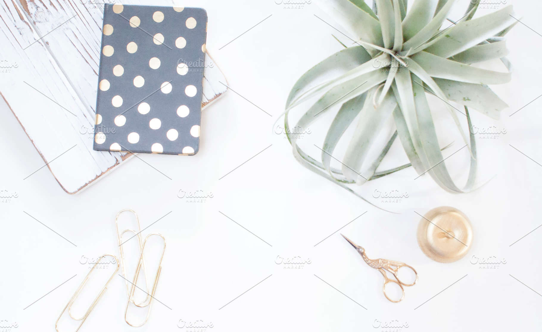Minimalistic gold and white desk containing stock photo, gold paperclips, and, a Business Photo by Grandview Collective