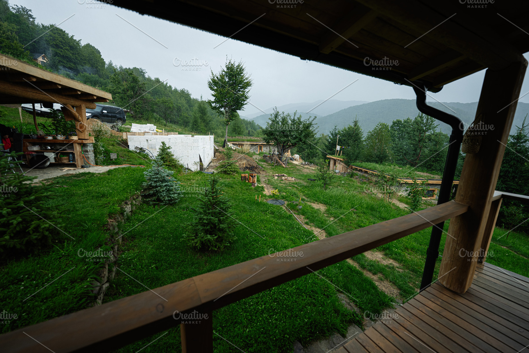 Rustic countryside scene with wooden structures surrounded by lush greenery and, a Photo by AS photostudio