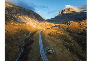 Aerial view of winding road in high, a Nature Photo by den-belitsky