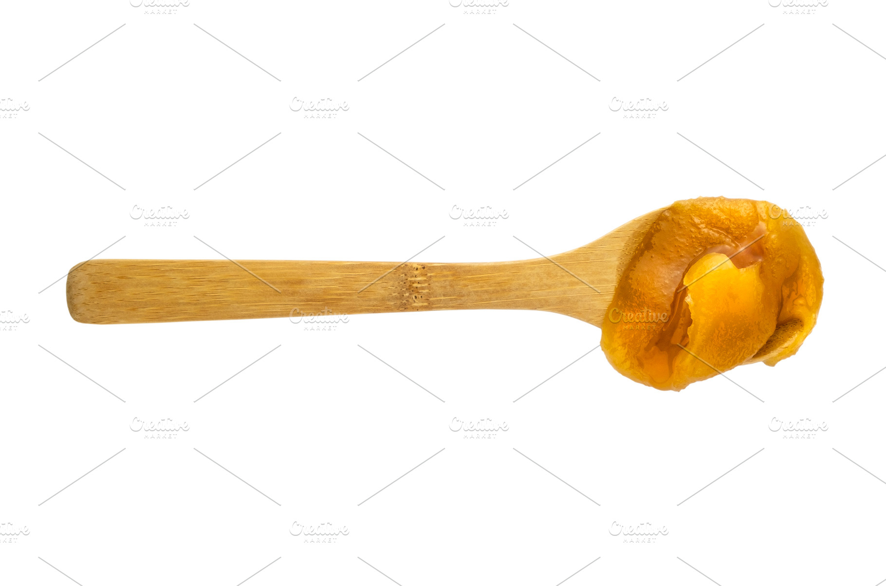 Fresh honey in a wooden spoon, a Food & Drink Photo by BOOCYS
