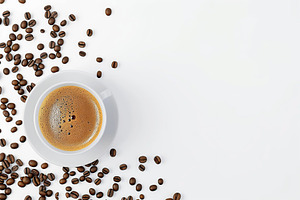 Flat lay of cup of coffee and coffee beans on white background, a Food & Drink Photo by AlyaAnd