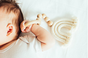 Close-up of a babys hand, playing