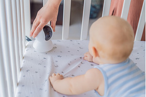 Baby monitor camera placed inside a, a Technology Photo by Elizaveta Galitskaya
