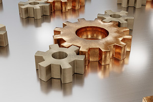 Metal gears scattered on smooth industrial steel surface, an Industrial Photo by RF Images