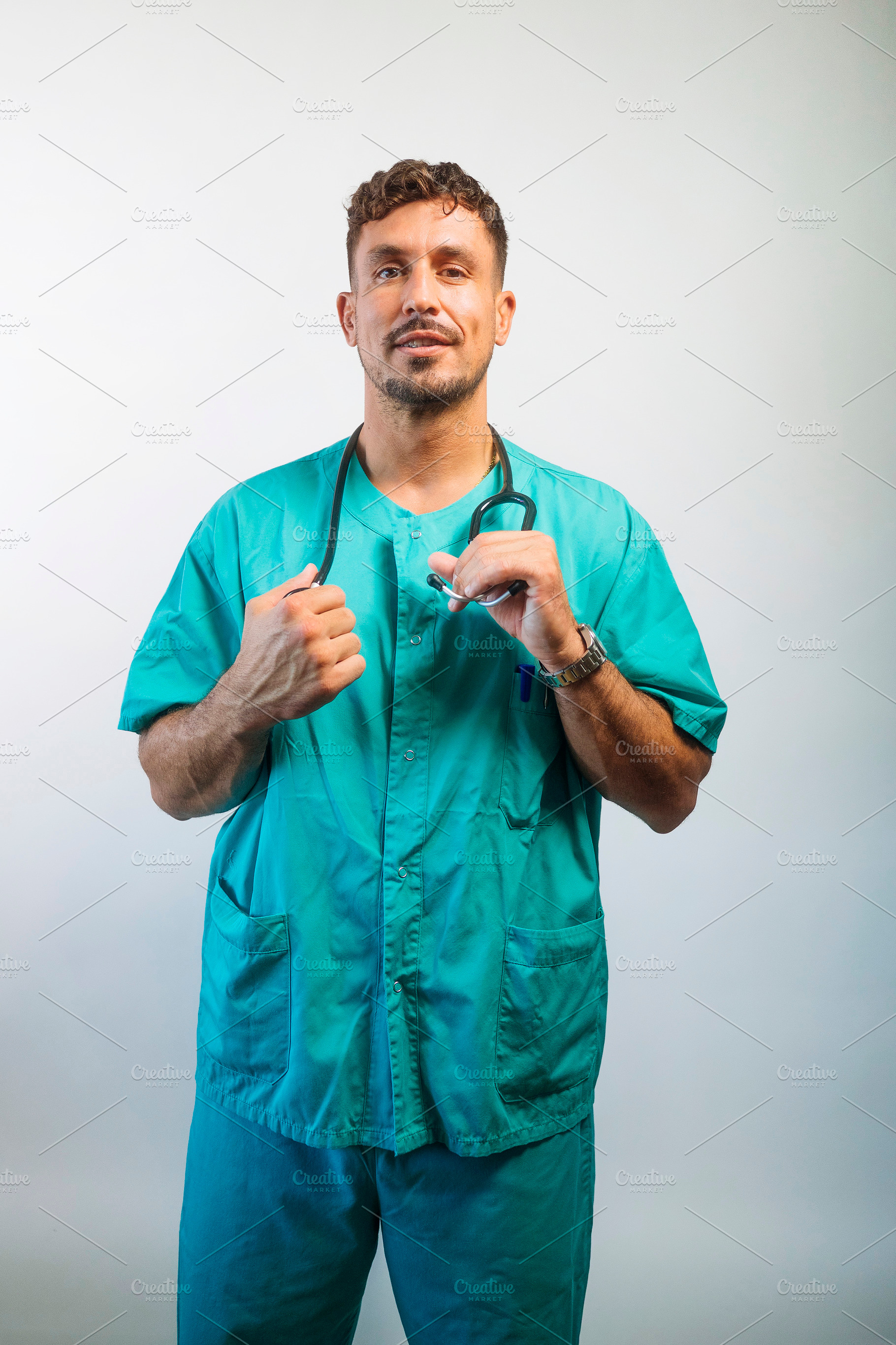 Doctor Adjusting His Stethoscope, a Person Photo by karrastock