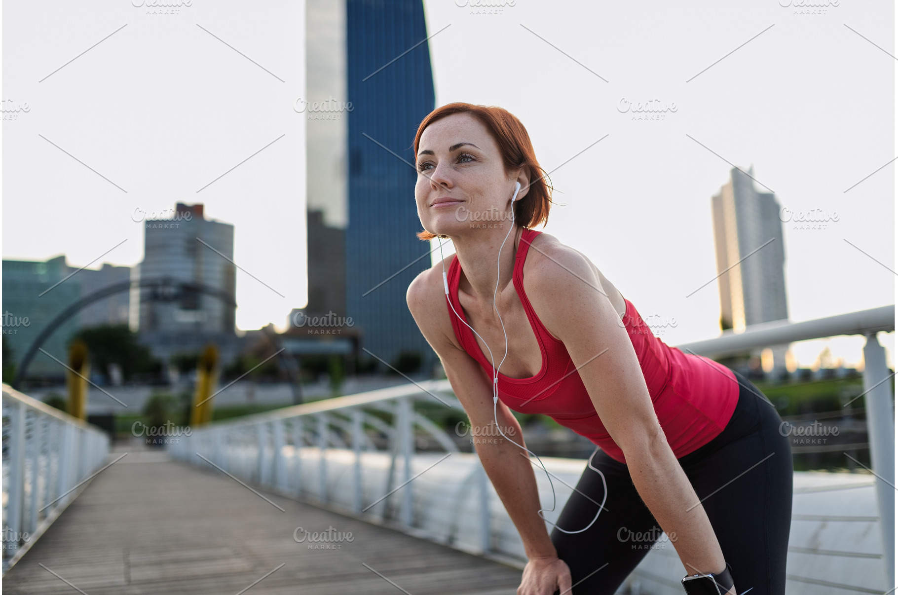 Female runner resting and catching, a Person Photo by HalfPoint