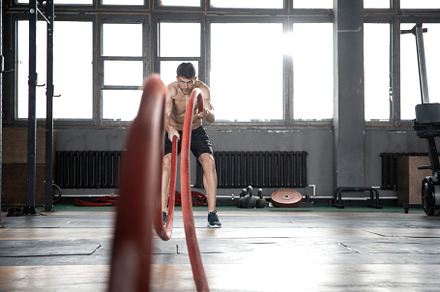 man with battle rope doing exercise, a Sports & Recreation Photo by OPOLJA