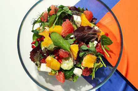Concept of tasty food, salad with red orange, top view, a Food & Drink Photo by AtlasStudio
