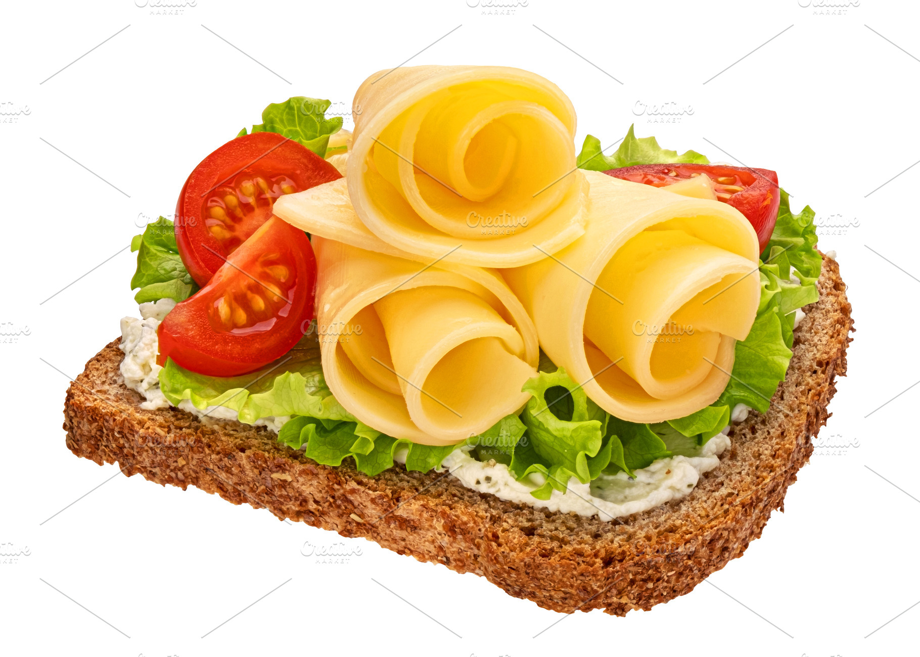 Cheese slices on rye bread isolated, a Food & Drink Photo by Max Lashcheuski