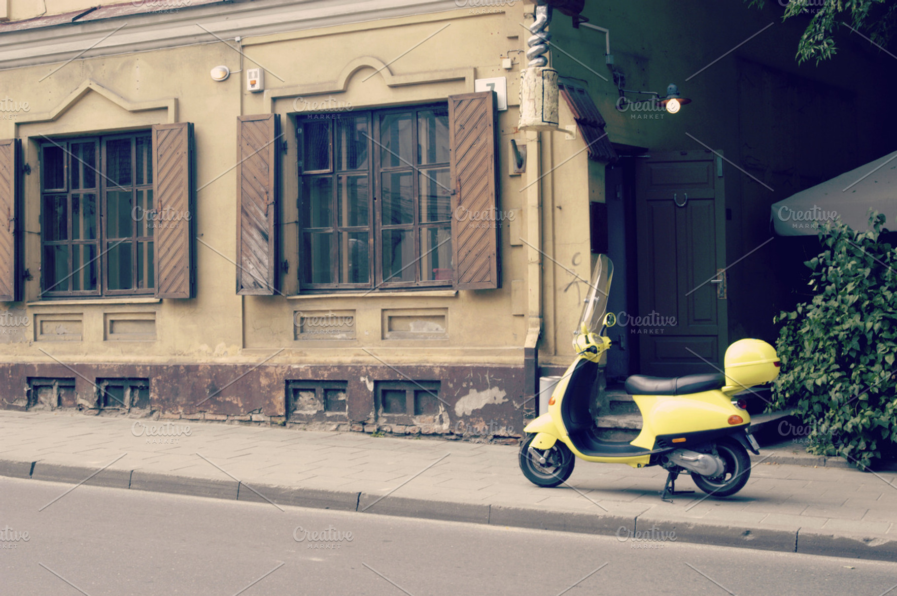 Yellow scooter on the street, a Transportation Photo by BOOCYS