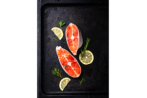 Raw uncooked salmon with rosemary, a Food & Drink Photo by Yulia Furman