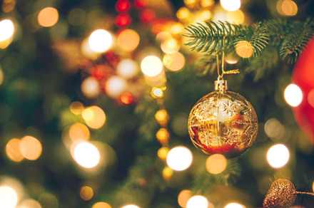 Decorated Christmas tree with gold ornaments. Merry Christmas and happy new yea, a Holiday Photo by Anikona