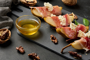 A delicious combination of sweet pear, salty prosciutto and crea, a Food & Drink Photo by ndanko