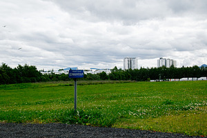 Private road sign amidst a green field in Reykjavik, Iceland, on a cloudy day, a Photo by AS photostudio