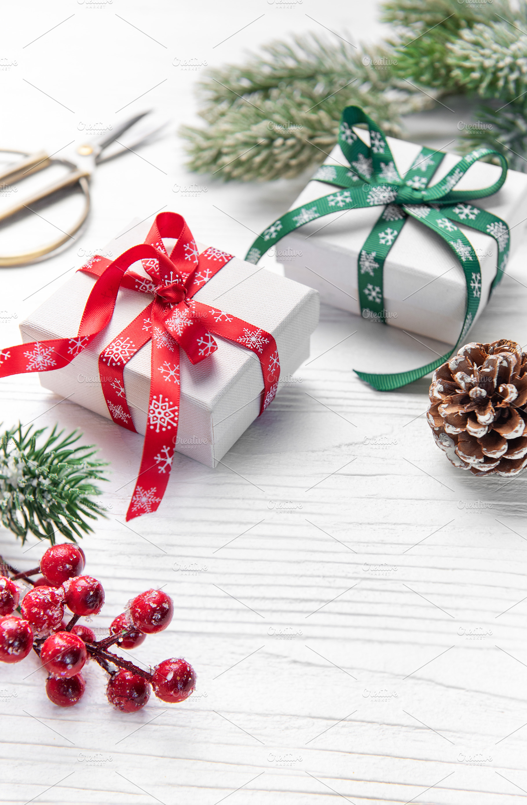 Christmas gifts wrapping on white wooden background, a Holiday Photo by Olena Rudo