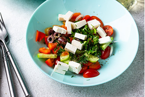 Greek salad with vegetables, olives, a Food & Drink Photo by Yulia Furman