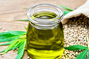 Oil hemp in jar with sheet containing hemp, cannabis, and grain, a Food & Drink Photo by rezkrr (Thumbnail 1 of 2)