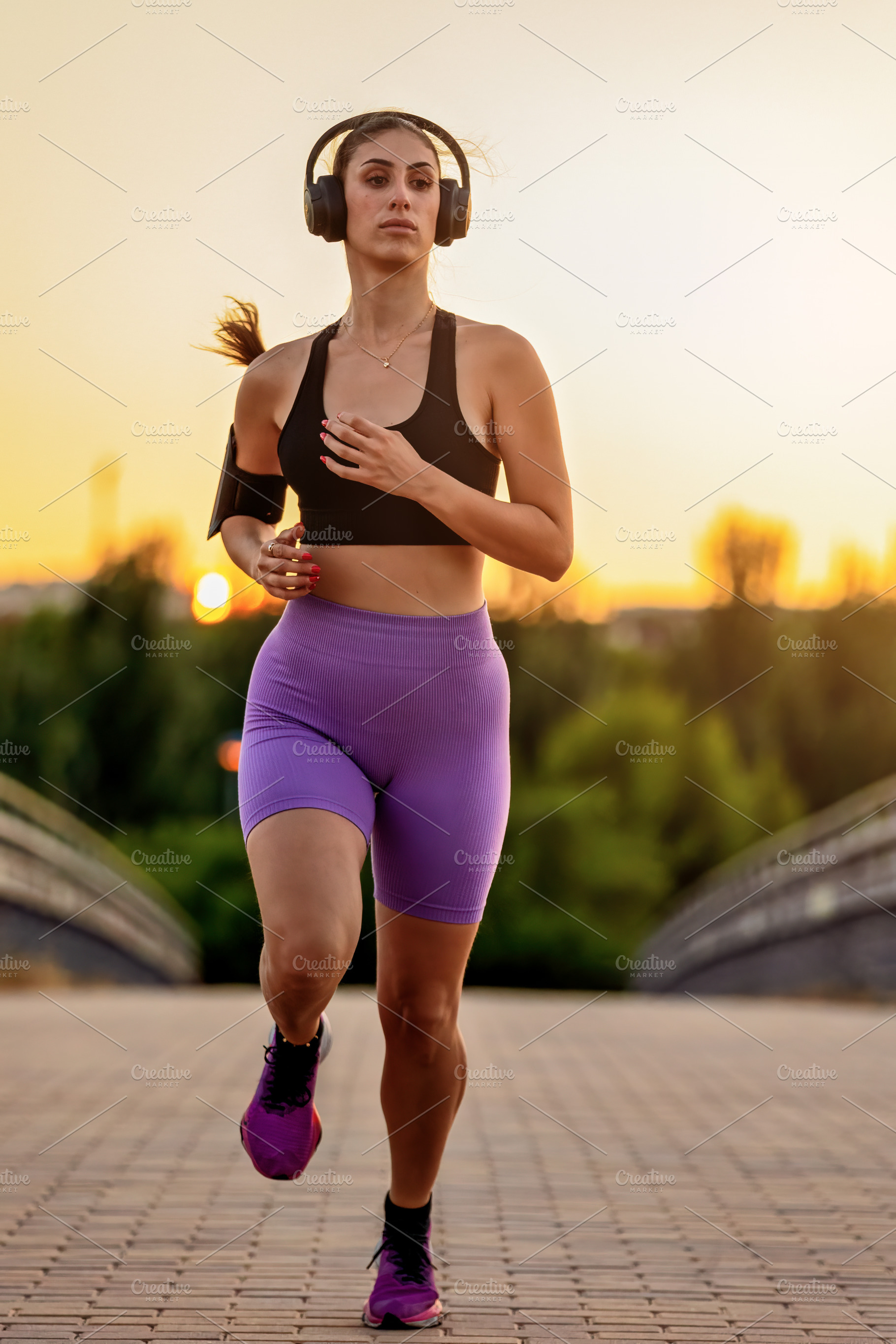 Young woman running outdoors at suns, a Sports & Recreation Photo by Perpis