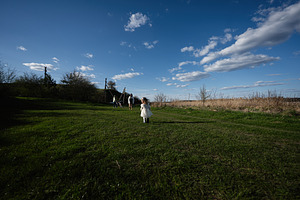 Family outing in the countryside with a little girl in a white dress running ac, a Person Photo by AS photostudio