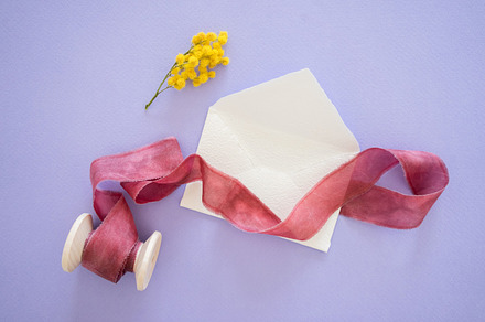 Paper and watercolor pack stock photo containing pastel shades and table