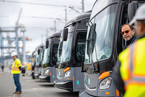 Modern buses at transportation hub with safety oversight, a Transportation Photo by AlyaAnd
