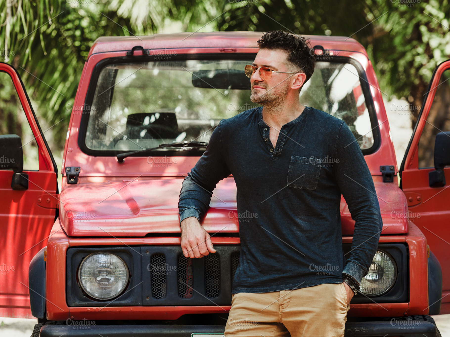 Attractive man and a red SUV. Closeup, outdoor, an Animal Photo by Svetlana Barchan