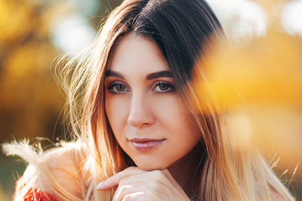 Atmospheric romantic autumn portrait of a young beautiful woman in a red knitte, a Person Photo by PavelKant