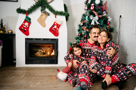 Family wearing matching Christmas pajamas, a Holiday Photo by YossSabalet