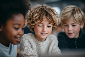 Engaged students collaborate on project in classroom, a School & Education Photo by OSORIOartist