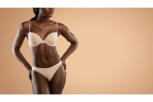 Cropped of black woman in underwear, a Person Photo by Prostock-Studio