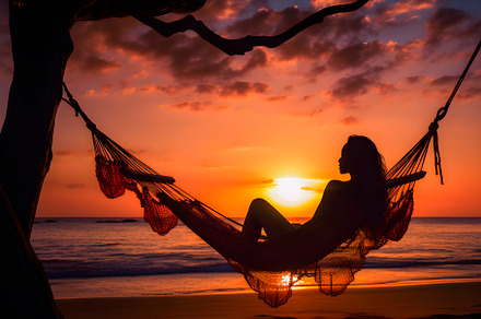 Silhouette of woman in a hammock on the beach watching a spectacular sunset. AI, a Person Photo by CreativePhotoSpain