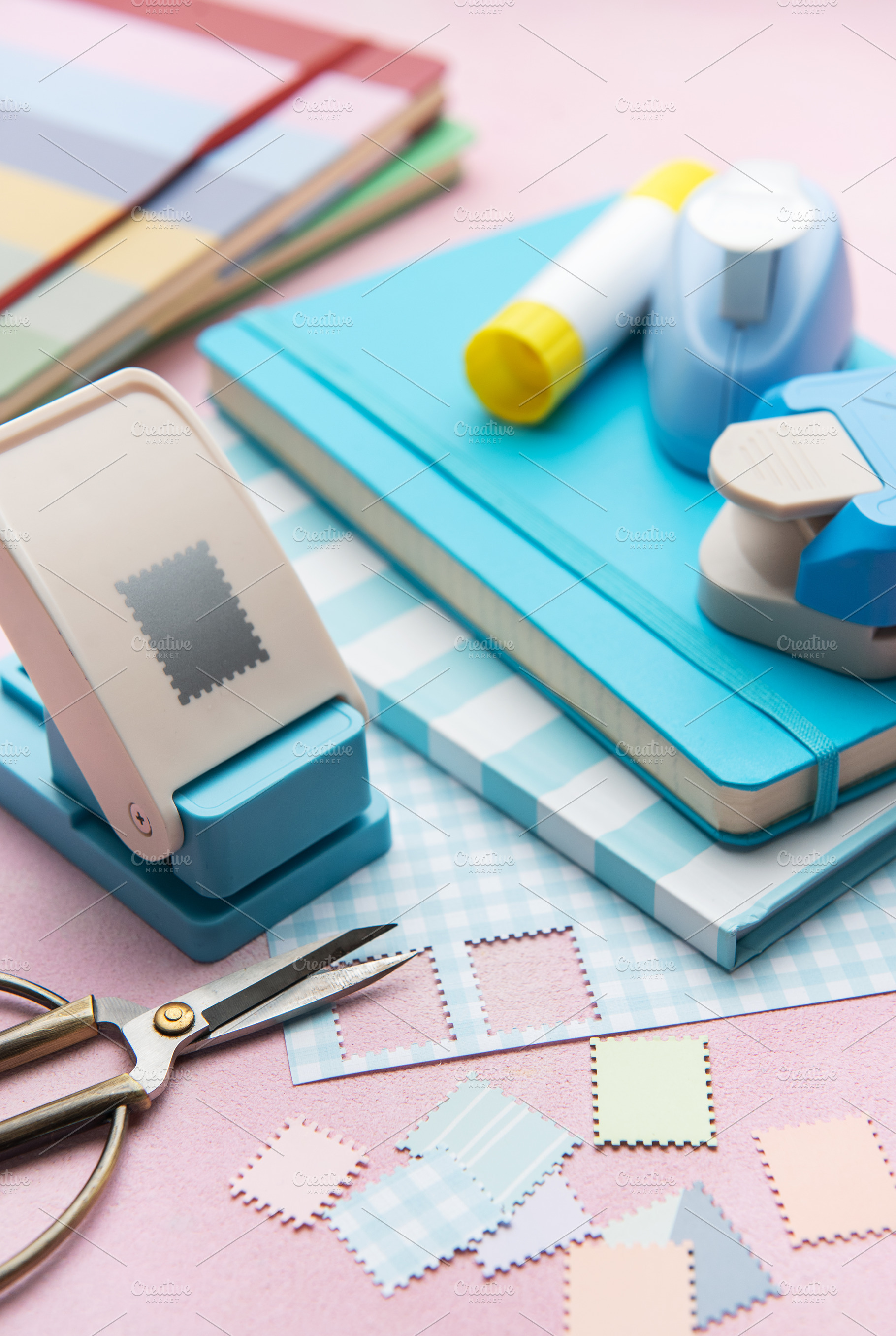 Crafting materials with paper punches and colorful notebooks, an Arts & Entertainment Photo by Olena Rudo