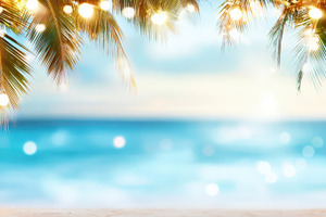 Palm trees decorated with Christmas lights against a tropical beach sunset. Con, a Holiday Photo by Mashimara