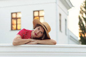Woman in red polka-dot dress rests, a Person Photo by Elena Vagengeim