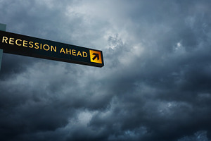 Road sign showing recession ahead against stormy sky. Concept of, a Photo by salmon.black